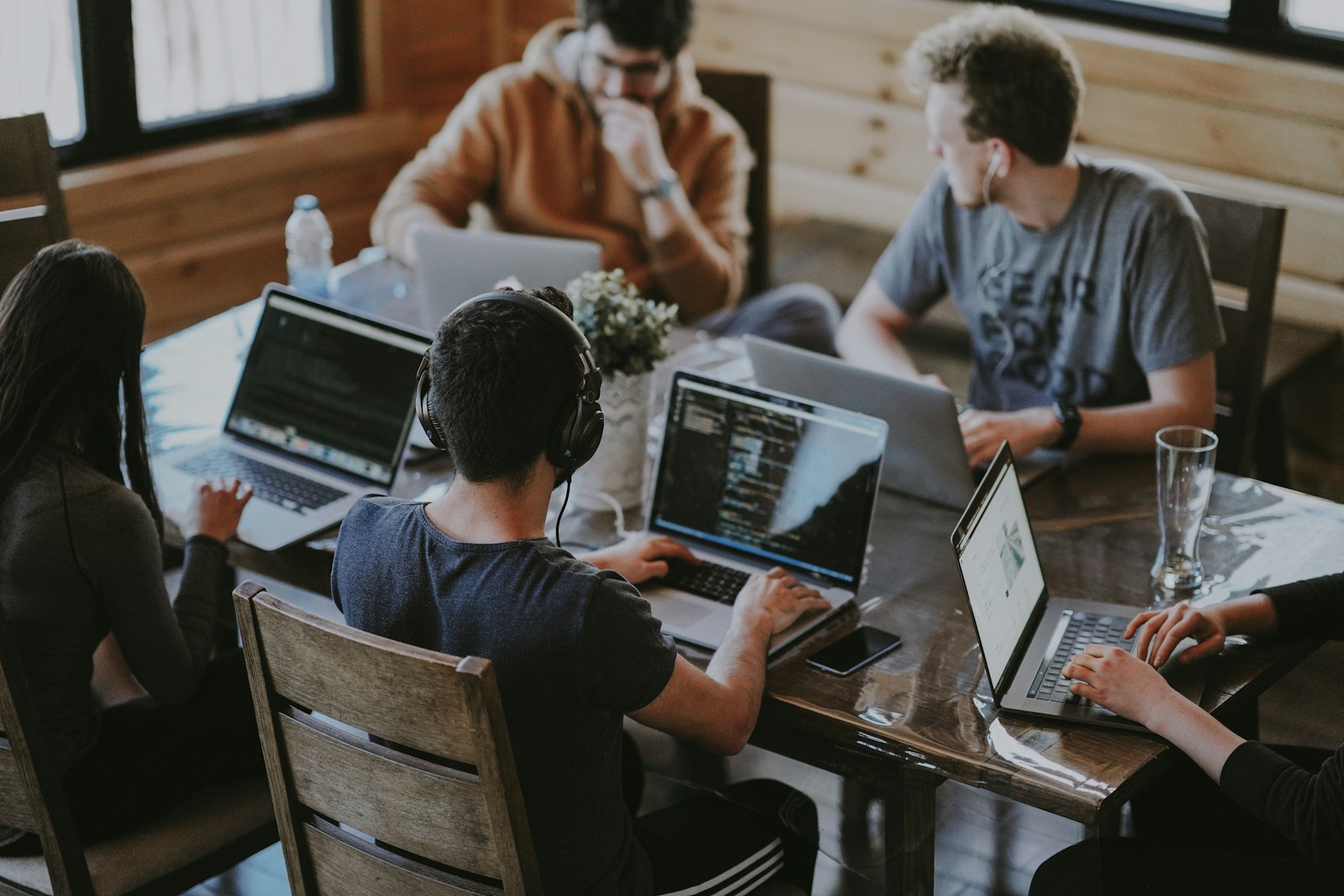 People collaborating around a table in a community workspace